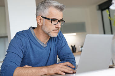 Adult completing an online course at home